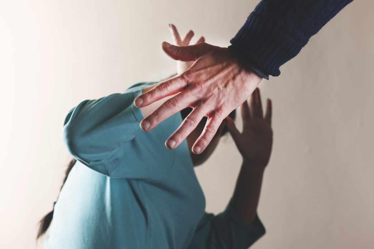 angry man beat sad woman